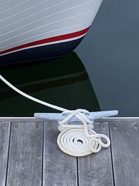 High angle view of rope tied on pier