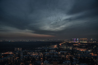 High angle view of illuminated city buildings against sky