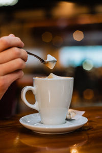 Close-up of coffee cup on table