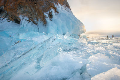 Close-up of frozen sea against sky