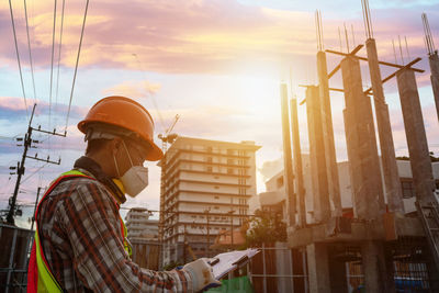 Rear view of man working at construction site