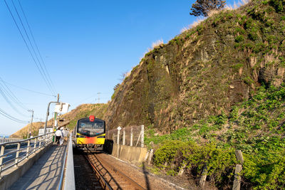 Train on railroad track against sky