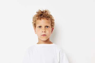 Portrait of boy against white background