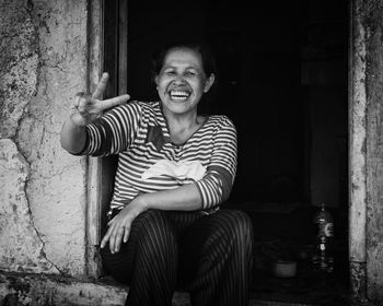 Portrait of teenage girl sitting outdoors