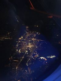 Close-up of illuminated fireworks against sky at night