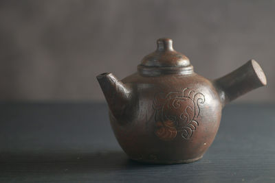 Close-up of traditional teapot  on table