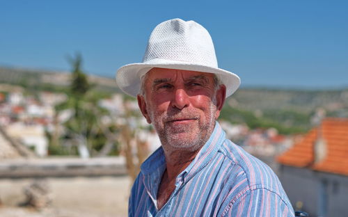 Portrait of man wearing hat