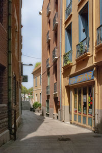 Street amidst buildings against sky