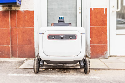 Automatic delivery robot for the transportation of goods and packages.futuristic robot electric car