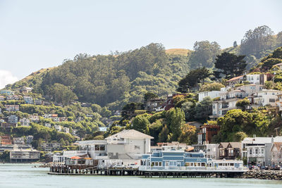 Scenic view of sea and buildings against sky