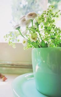 Close-up of flower vase on table