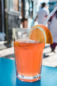 Close-up of orange drink on table