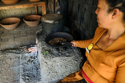 Midsection of man preparing food