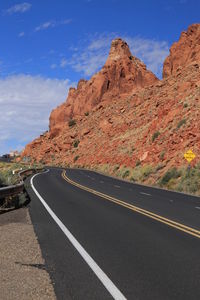 Scenic view of mountain road against sky