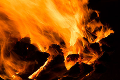 Close-up of fire burning at night