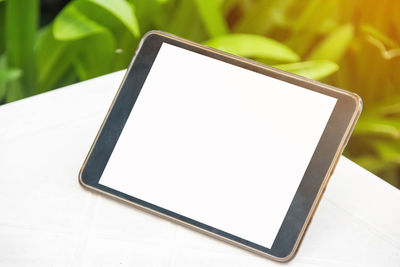 High angle view of digital tablet on table