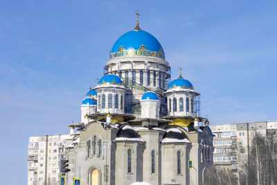 Low angle view of building against blue sky