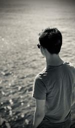 Rear view of man looking at sea