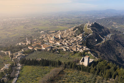 Aerial view of assisi umbria with the city in the background at sunrise