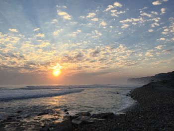 Scenic view of sea at sunset