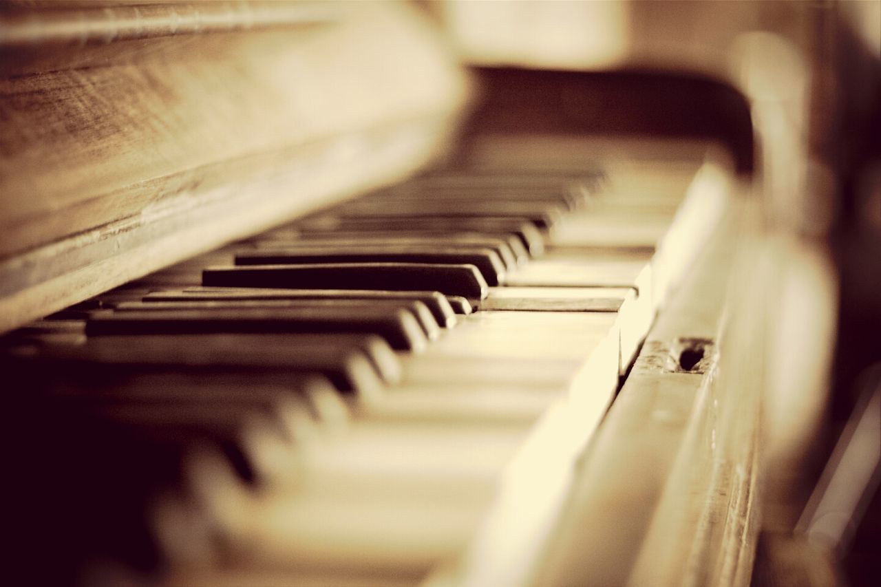 indoors, music, musical instrument, arts culture and entertainment, selective focus, piano, piano key, musical equipment, close-up, in a row, technology, high angle view, still life, no people, focus on foreground, guitar, musical instrument string, repetition, audio equipment, steps