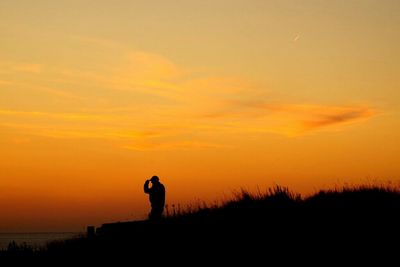 Silhouette of people at sunset