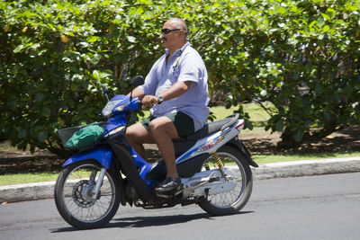 Man riding bicycle on road