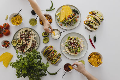 People sharing various healthy mexican food