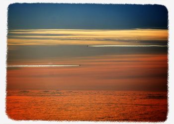 Scenic view of sea at sunset