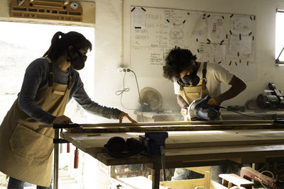 Carpenters working in workshop