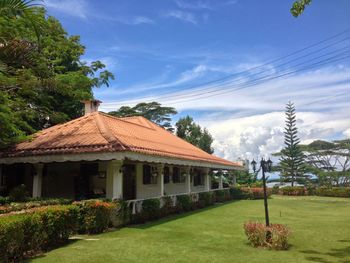 House on field against sky