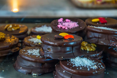 Close-up of handmade dark chocolate alfajor