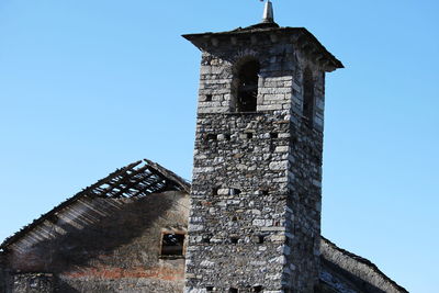 Low angle view of bell tower against clear sky