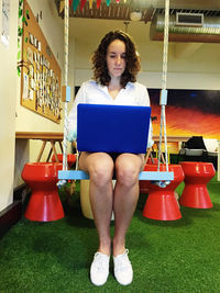 Portrait of a young man sitting on bench