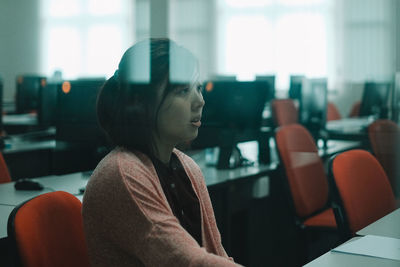 Woman sitting in classroom