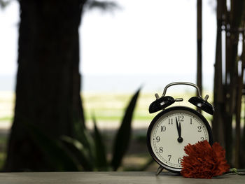 Close-up of clock on table