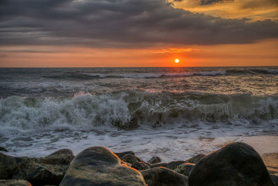 Scenic view of sea against sky during sunset