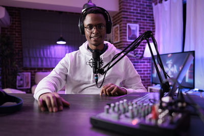 Portrait of male blogger at studio