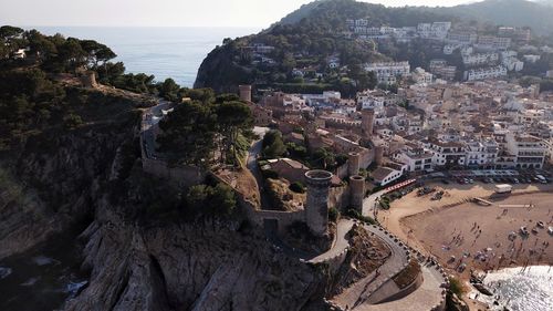 High angle view of townscape by sea