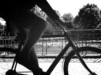 Cropped image of person walking on bridge