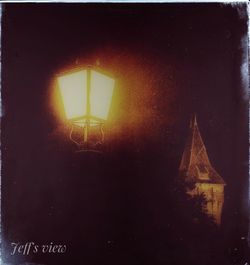 Low angle view of illuminated building against sky