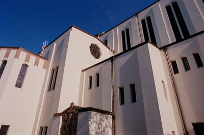 Low angle view of building against clear blue sky