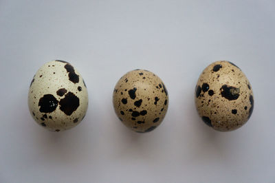 Close-up of eggs on white background