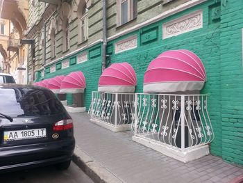 Cars on street against buildings in city