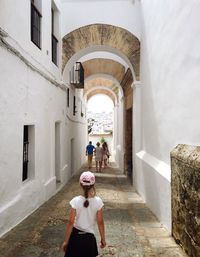 Woman standing by railing