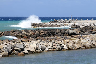 Scenic view of sea against clear blue sky