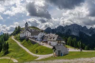 Buildings against cloudy sky