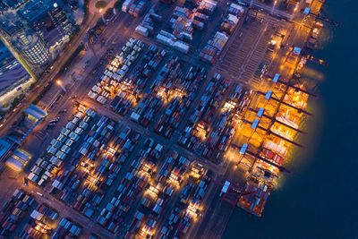 High angle view of city lit up at night