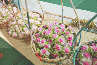 High angle view of pink flower pot on table