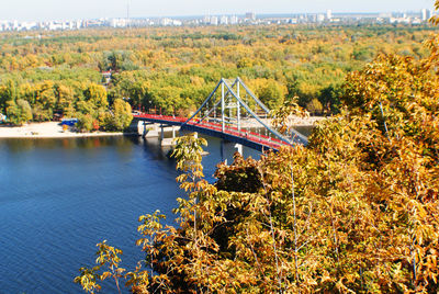 Bridge over river during autumn